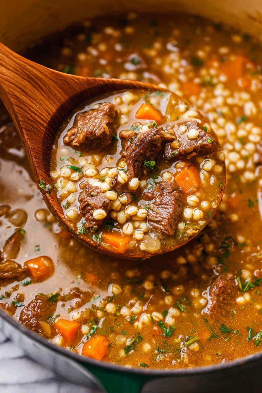 The image shows a close-up of a wooden spoon lifting a thick stew from a large pot. The stew has three main visible layers: chunks of brown cooked meat, small round light beige grains, and small diced vegetables including orange carrots and green herbs, all mixed in a rich, glossy brown broth with some herbs scattered throughout. The background features the inside edge of the pot filled with more of the stew, and the whole scene rests on a white marbled surface. photo taken with an iphone --ar 2:3 --v 7